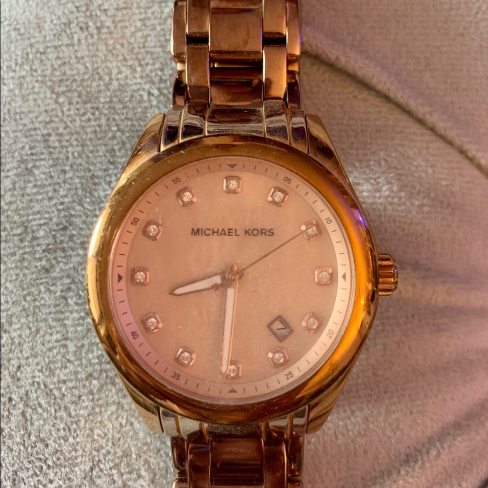 Michael Kors Gold women’s wrist watch.